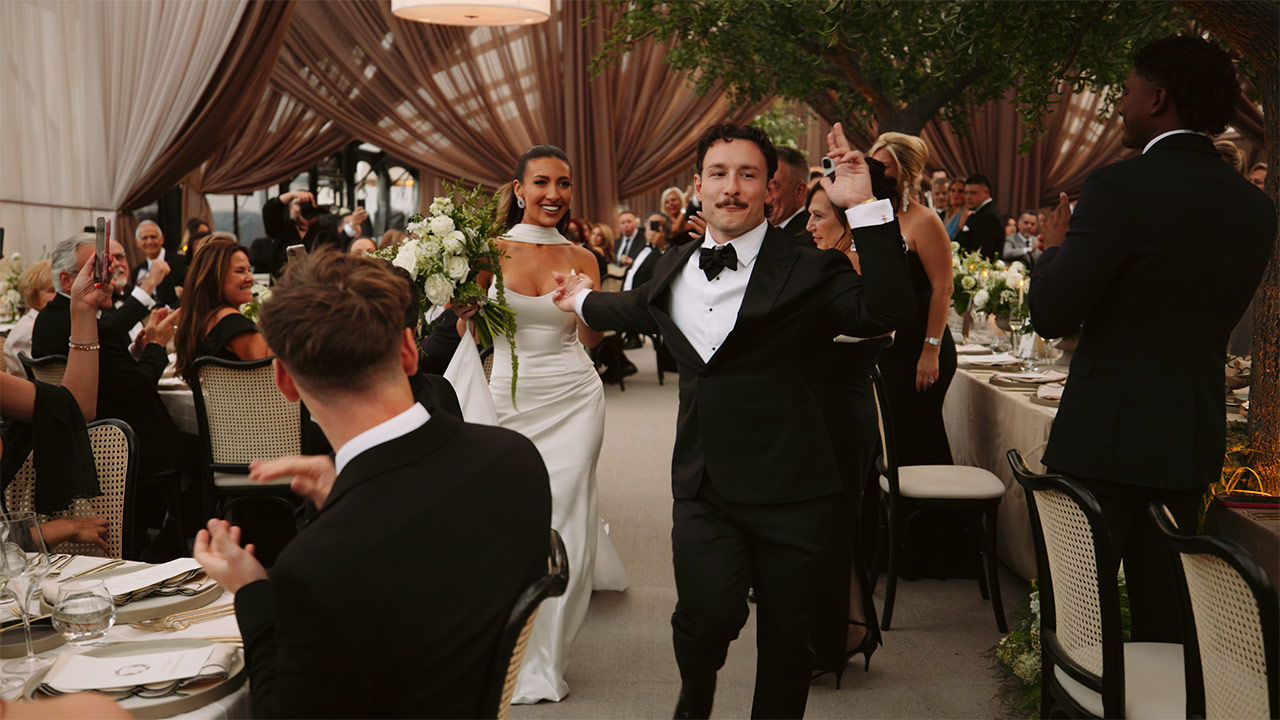Alessandra and Steve entering their wedding at the Aga Khan Museum