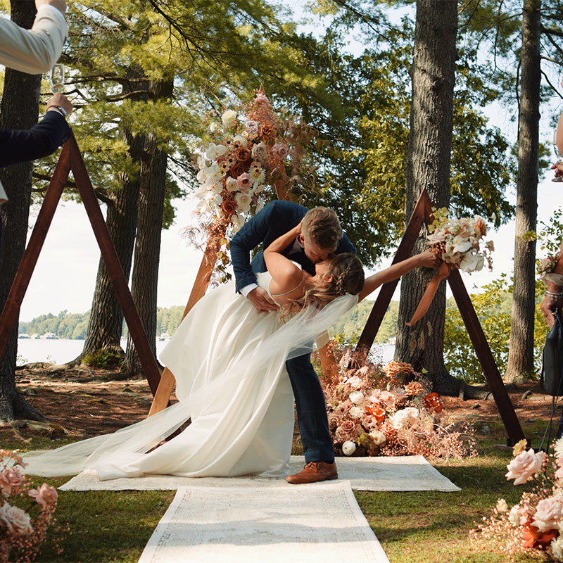 Couple shares first kiss at their Sherwood Inn wedding in Muskoka