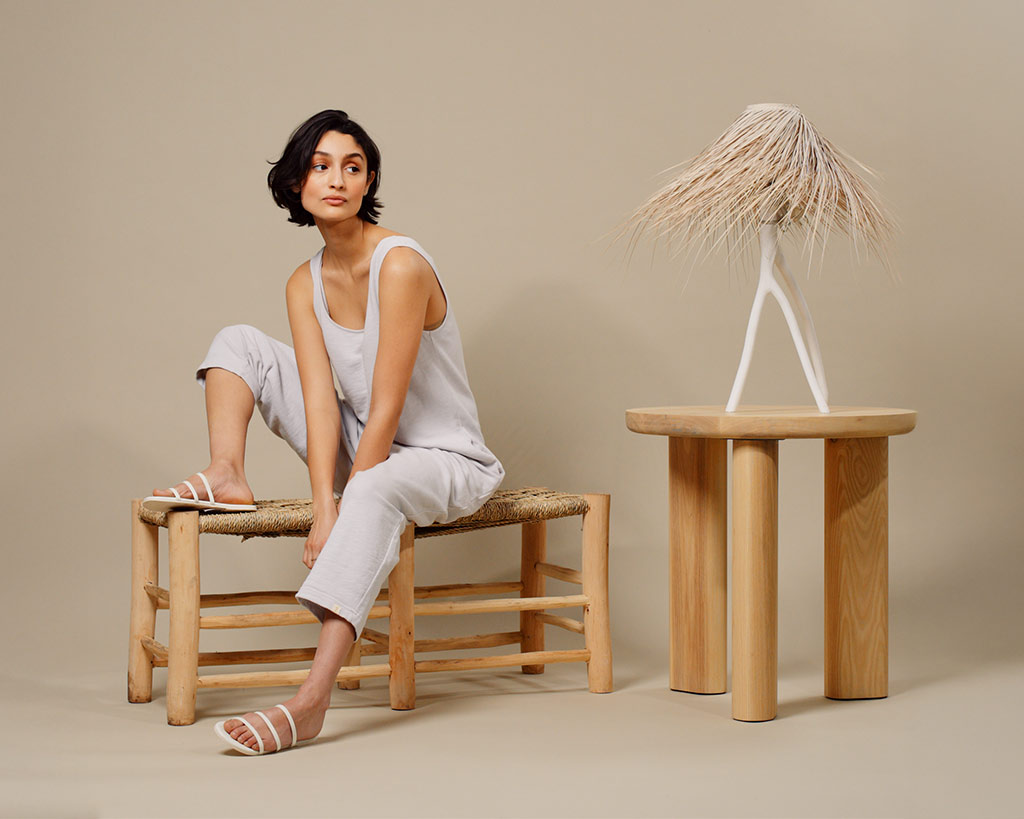 Model sits in Boho set for TKEES branded social video content shoot