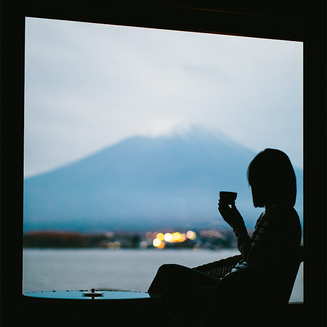 Vic staring at Mt. Fuji from her hotel window at dusk